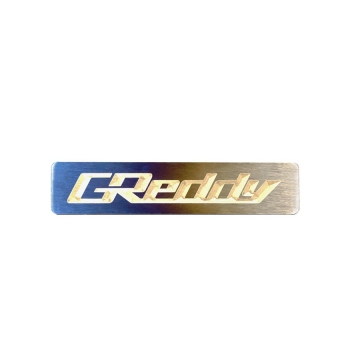 GReddy Burnt Ti Titanium Logo Emblem - 70x15mm