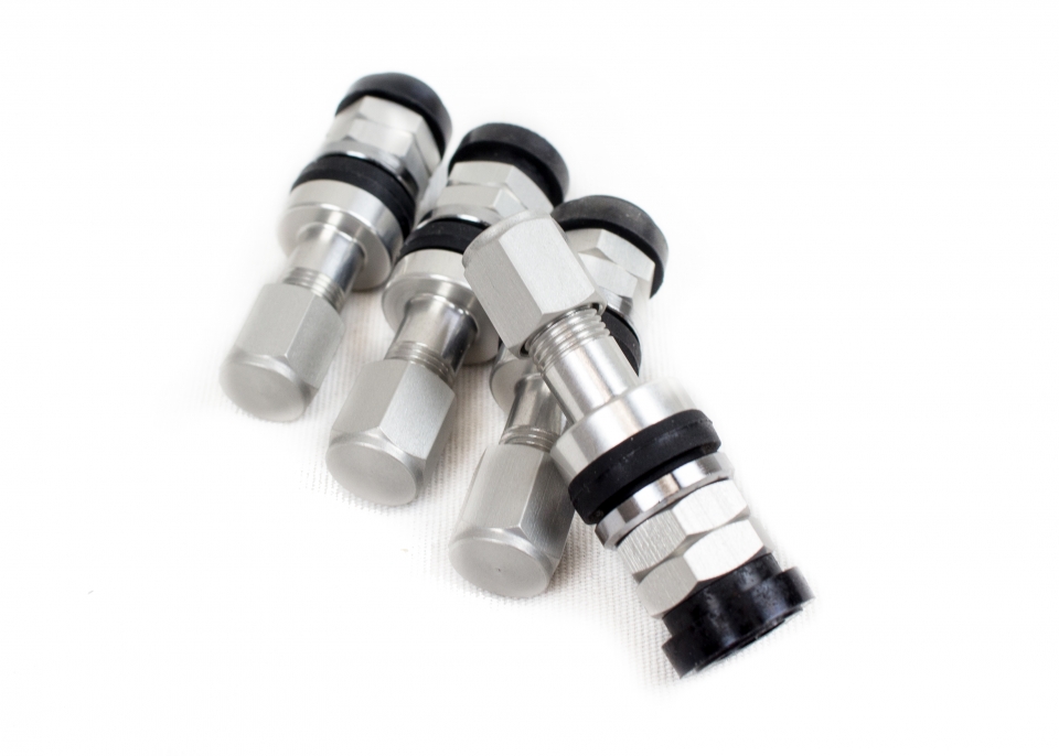 4-Piece Silver Aluminum Valve Stem Caps – Racing R Style – Fits Nissan – CNC Machined, Lifetime Warranty